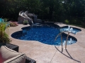 Custom Fiberglass Pool with Tanning Ledge and Rock Slide Waterfall